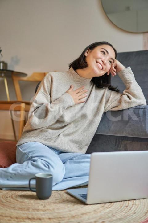 Portrait dreamy woman sitting with laptop floor watching computer drinking coffee enjoy 1258 139020 jpg